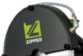 Close-up of a black industrial machine component with a green logo and 'ZIPPER' text (no additional signage or symbols visible)