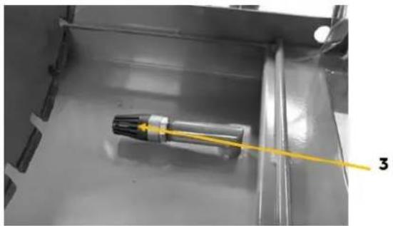 Close-up of a mechanical component with a yellow wire and label '3' pointing to it (no readable text or symbols beyond label)