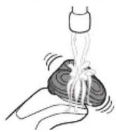 Illustration of a hand holding a small object with a bottle inserted into it, emitting a bundle of wires (no text or symbols)