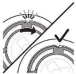 Diagram showing mechanical components with arrows and a checkmark, no readable text or symbols present