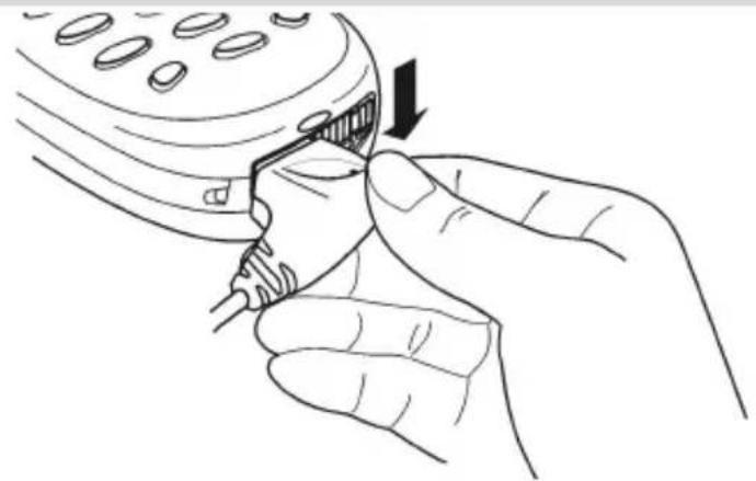 Line drawing of hands inserting a cable into a device (no text or symbols)