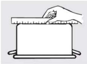 Simple line drawing of a hand using a ruler to press a rectangular object on a tray (no text or symbols)