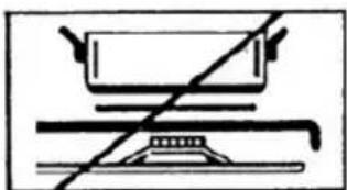 Simple line drawing of a cooking pot and a flat surface with diagonal lines (no text or symbols)
