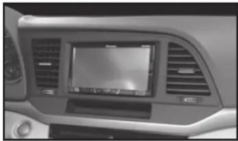 Interior view of a car dashboard with air vent and touchscreen (no visible text or symbols)