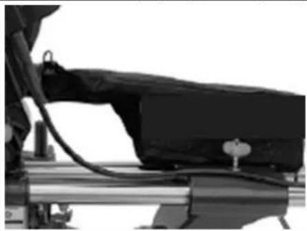Close-up of a mechanical device with attached cable and lever (no visible text or symbols)