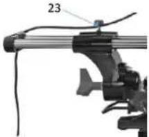 Close-up of a mechanical clamp or lever assembly with labeled part '23' (no readable text or symbols beyond label)