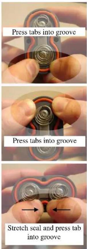 Press tabs into groove Press tabs into groove Stretch seal and press tab into groove