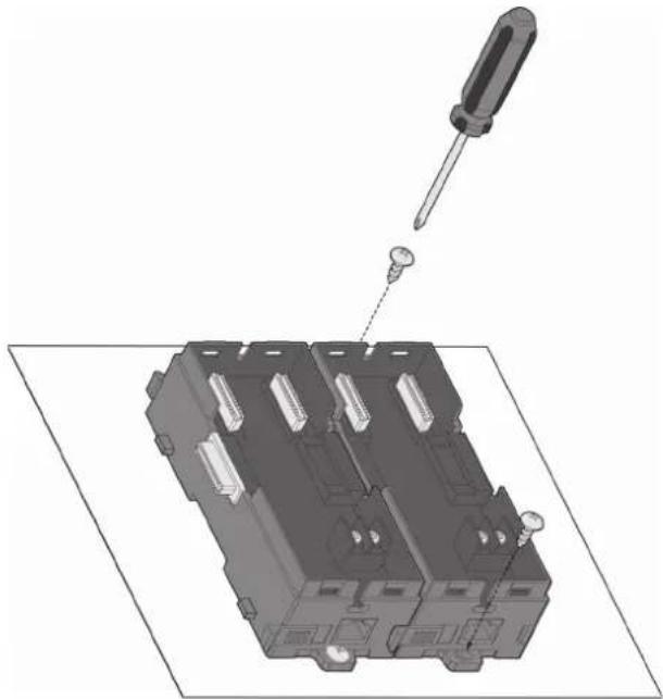 3D mechanical assembly diagram showing a screwdriver inserted into a housing with multiple slots and mounting holes (no text or symbols visible)