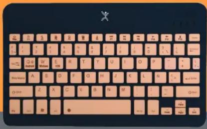 Close-up of a standard computer keyboard with beige and pink color scheme, featuring the letter 'X' at top left.