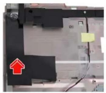 Close-up of a mechanical or electronic component with a red arrow pointing upward and a yellow label, no visible text or symbols.