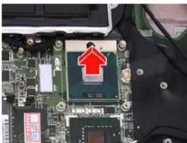 Close-up of a computer motherboard with a red upward arrow and chip (no visible text or symbols).