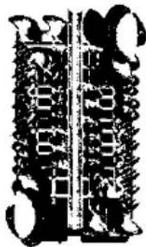 Historical black-and-white photograph of two vertical columns with ornate border designs and central text, possibly from a document or inscription.
