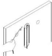 Line drawing of a hand holding a tool near a vertical panel (no text or symbols)