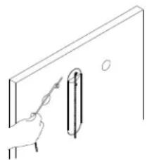 Simple line drawing of a hand holding a pen, with a vertical tube inserted into the wall (no text or symbols)