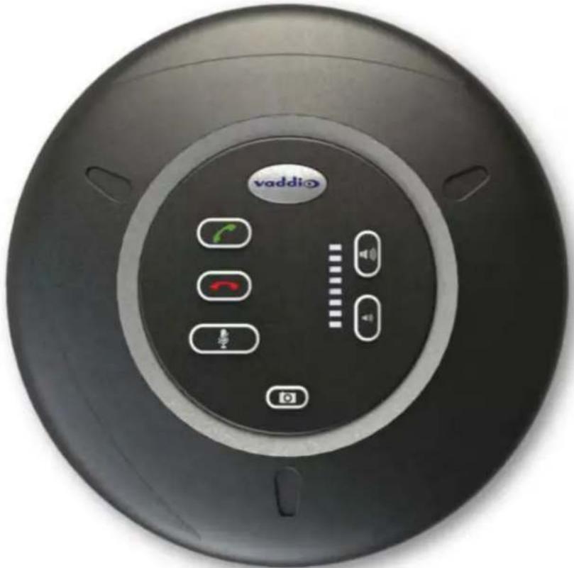 Top-down view of a black circular device with a Vaddio brand logo and four function buttons (no readable text or symbols beyond branding)