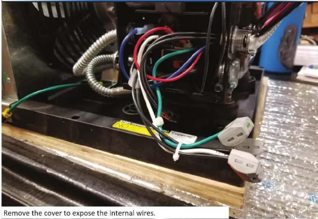 Remove the cover to expose the internal wires.