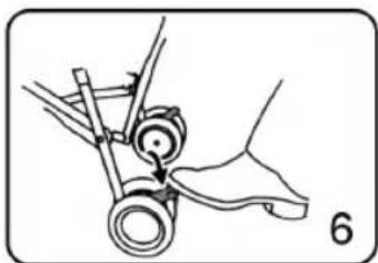 Mechanical diagram showing a hand operating a wheel and shaft assembly (no text or symbols)