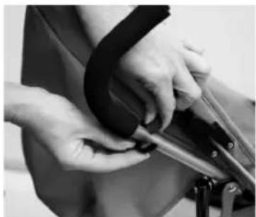 Close-up of hands using crimping tools to adjust a black object (no visible text or symbols)