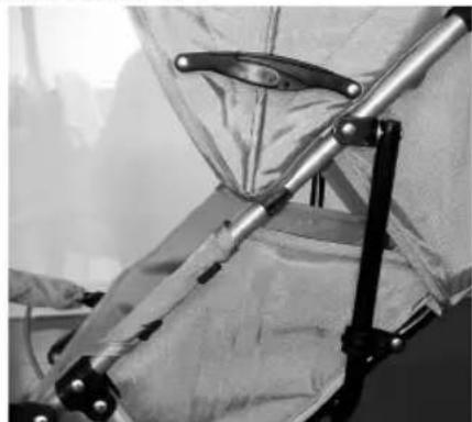 Close-up of a person wearing protective gear with metal clips, no visible text or symbols