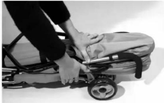 Person pushing a stroller with hands on the seat (no visible text or symbols)