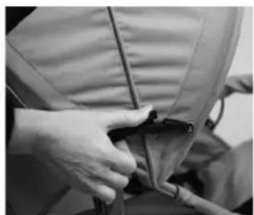 Close-up of hands adjusting a jacket with a zipper (no visible text or symbols)