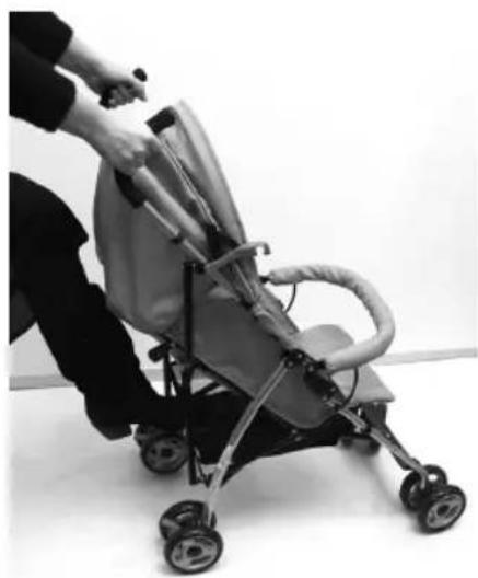 Person pushing a baby stroller in a studio setting (no text or symbols visible)