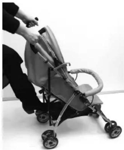 Person using a baby stroller to lift a child's arm (no text or symbols visible)