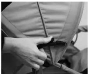 Close-up of hands adjusting a garment with a zipper (no visible text or symbols)