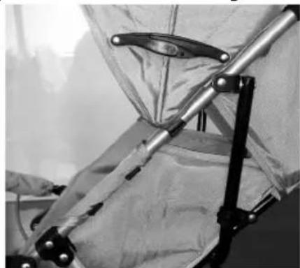 Close-up of a medical or surgical device with metallic components and a transparent sheet, no visible text or symbols