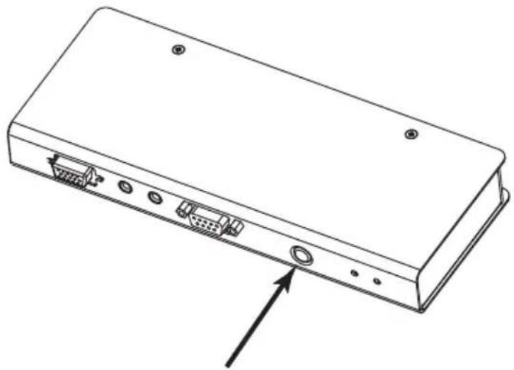 Line drawing of a rectangular electronic device with ports and connectors, showing an arrow pointing to the front panel (no text or symbols present)