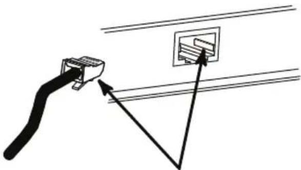 Diagram showing a cable connector inserted into a socket, with arrows indicating direction (no text or symbols)