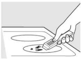 Line drawing of a hand using a spatula to clean or store food on an induction cooktop (no text or symbols)
