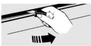 Hand holding a tool with an arrow indicating direction (no text or symbols present)