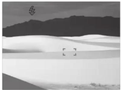 Monochrome landscape photo of rolling hills and dunes under a cloudy sky (no text or symbols)
