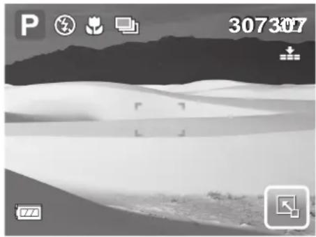 Black-and-white landscape photo of a desert with sand dunes and distant mountains, no visible text or symbols