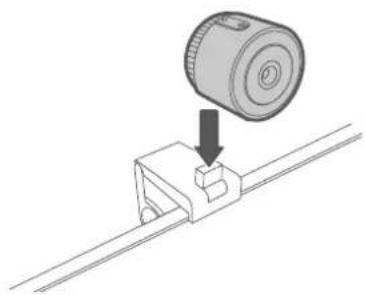 Technical illustration of a mechanical component with a cylindrical component and a downward arrow indicating assembly (no text or symbols)