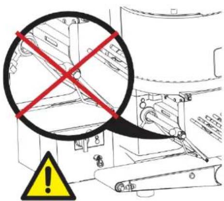 Technical diagram showing a mechanical assembly with red X marks and a yellow warning symbol, likely indicating failure or hazard.