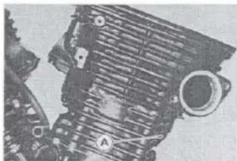 Close-up of a mechanical engine component with visible gears and shafts (no text or symbols)