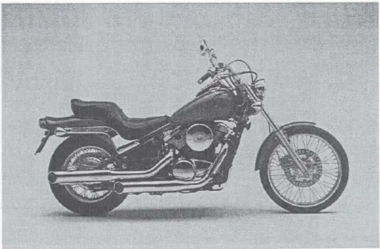Side profile of a vintage motorcycle with visible engine and wheel (no text or symbols)