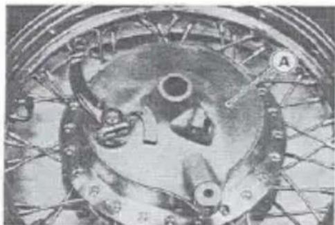 Close-up of a mechanical component with visible gears and mounting holes (no text or symbols)