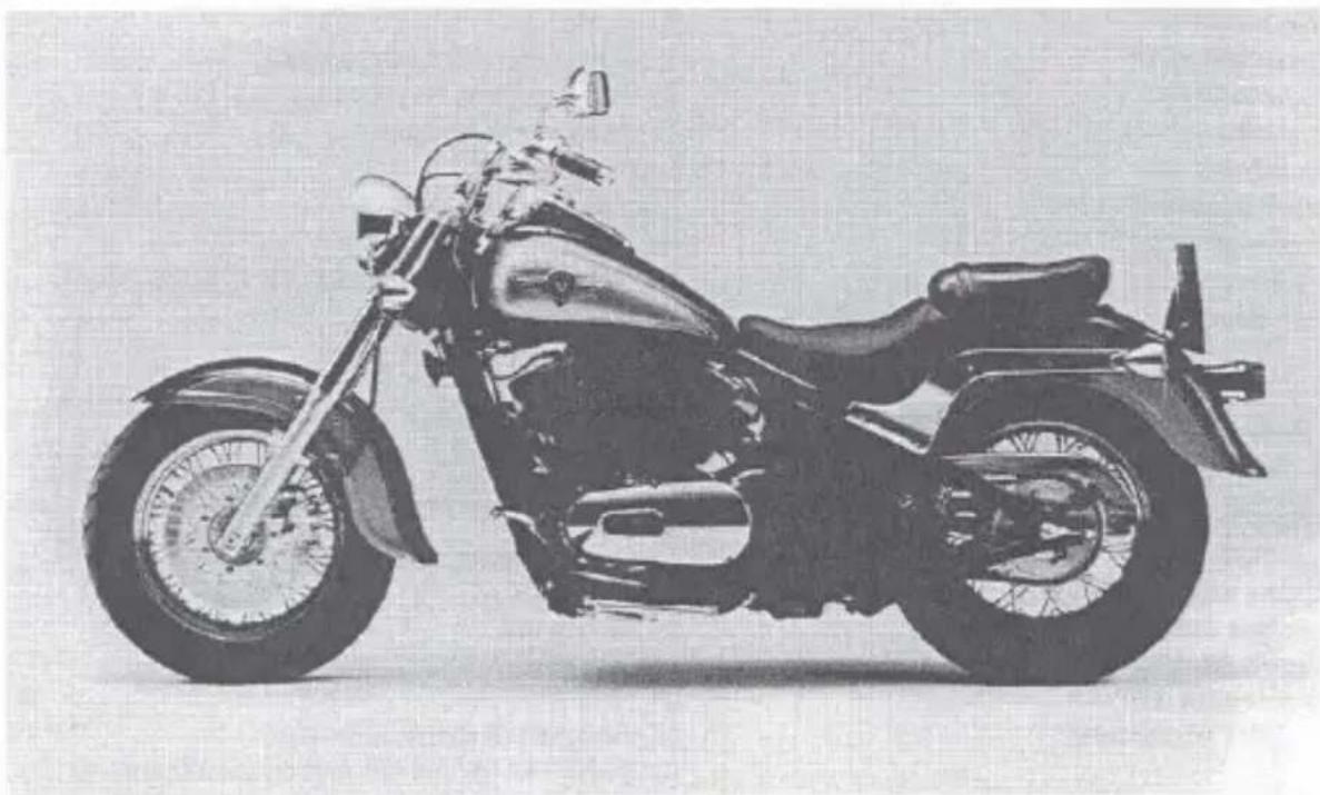Side profile of a vintage motorcycle with long wheels and front wheel (no visible text or symbols)
