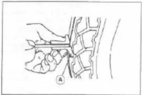 Line drawing of a hand holding a tool over a mechanical component, with no visible text or symbols