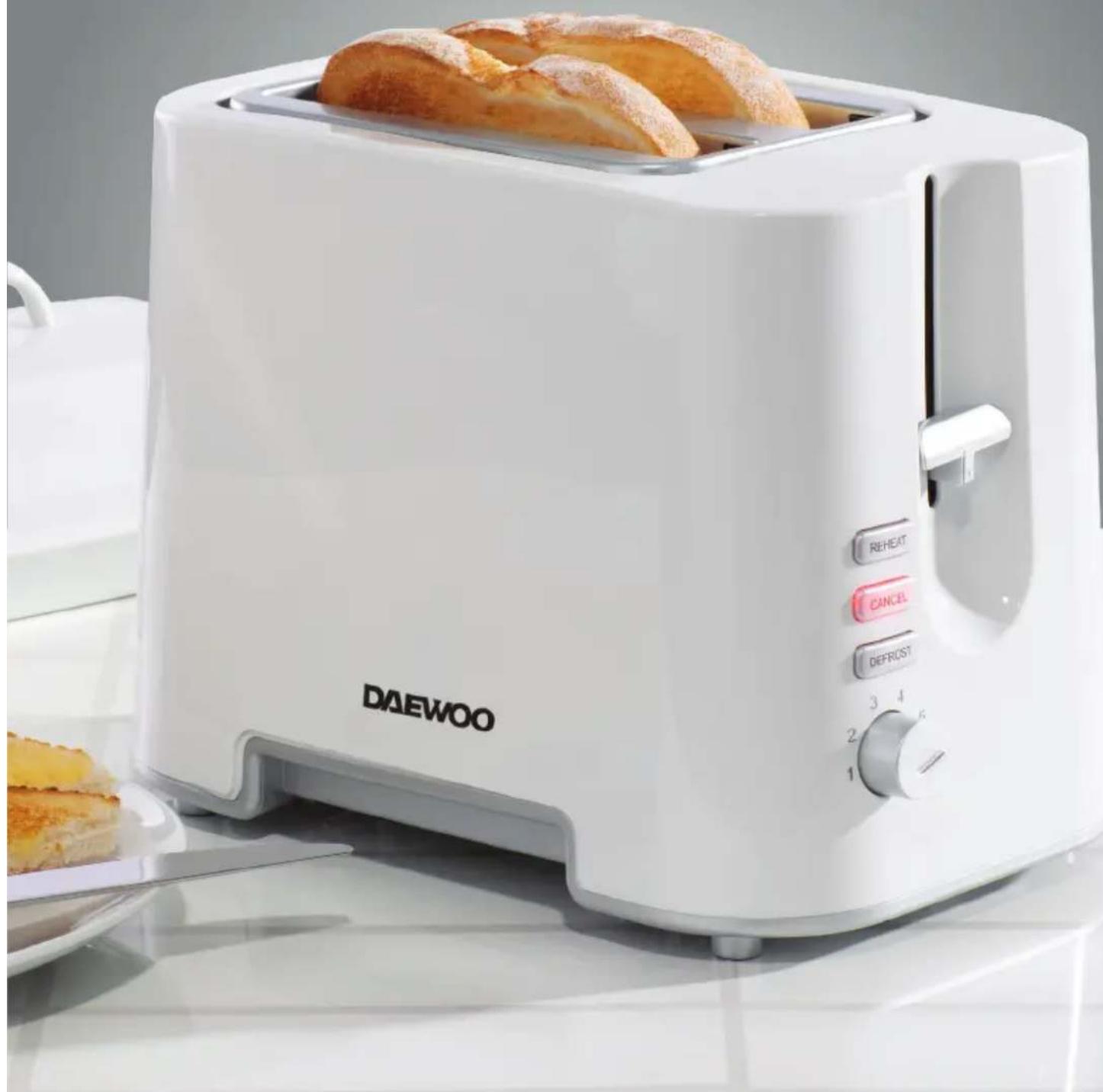 White DAEWOO rice cooker with three slices of baked bread, showing control buttons and a side dish (no readable text or symbols on the device itself).