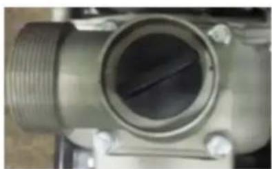 Close-up of a metallic mechanical component with threaded end and central bore (no visible text or symbols)