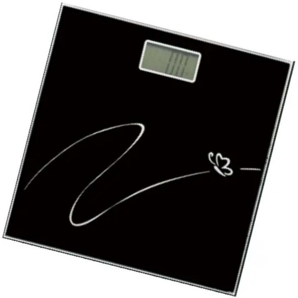 Digital kitchen scale with white hand-drawn sketch of a heart symbol on black background, showing measurement and design elements