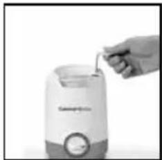 Hand pouring liquid into a small container (no visible text or symbols)