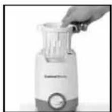 Close-up of a kitchen blender with a hand inserting a plastic into it (no visible text or symbols)