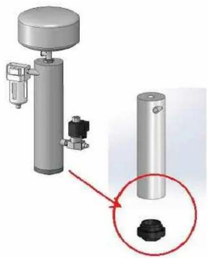 Mechanical assembly diagram showing a cylindrical device with attached components and a magnified inset highlighting a small black component (no text or symbols present)