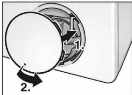Diagram showing a device with labeled parts and directional arrows, likely illustrating a mechanical or electrical component.
