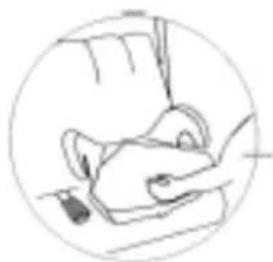 Simple line drawing of a person sitting at a desk, viewed through a circular frame (no text or symbols).
